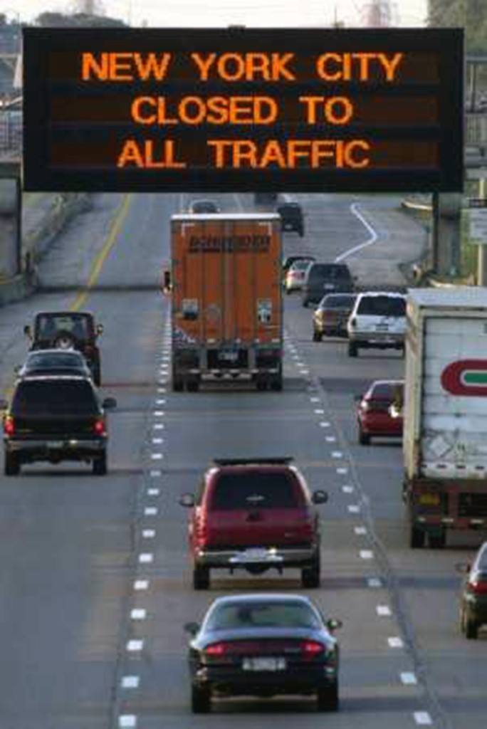 Highway sign reading New York City Closed to All Traffic